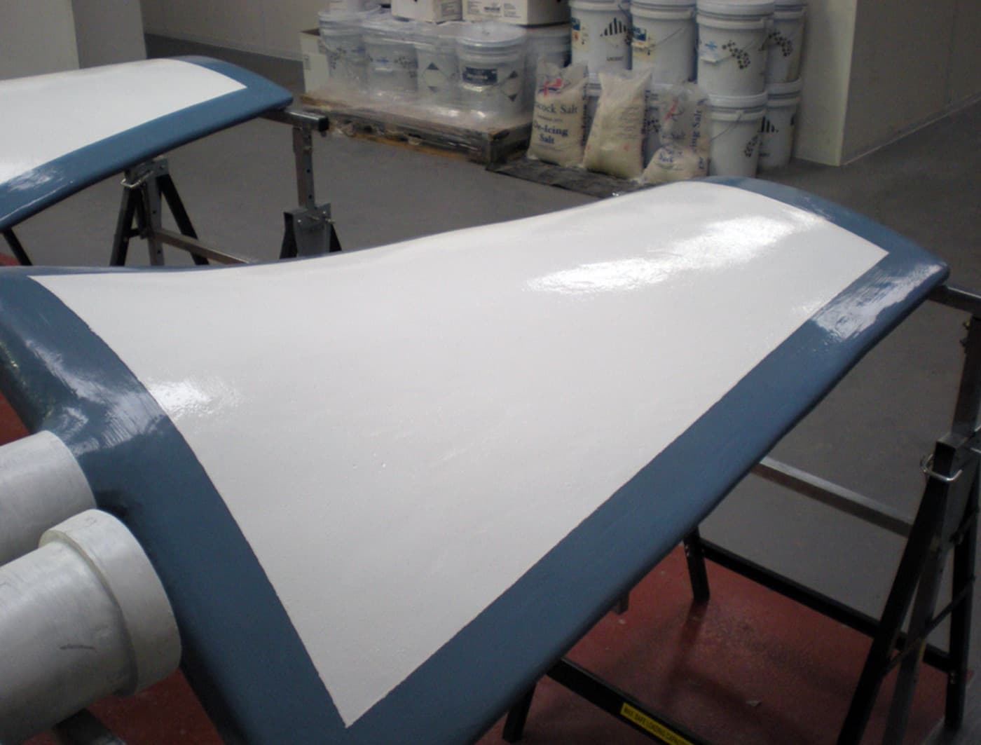 Erosion protection applied to a high-velocity surface