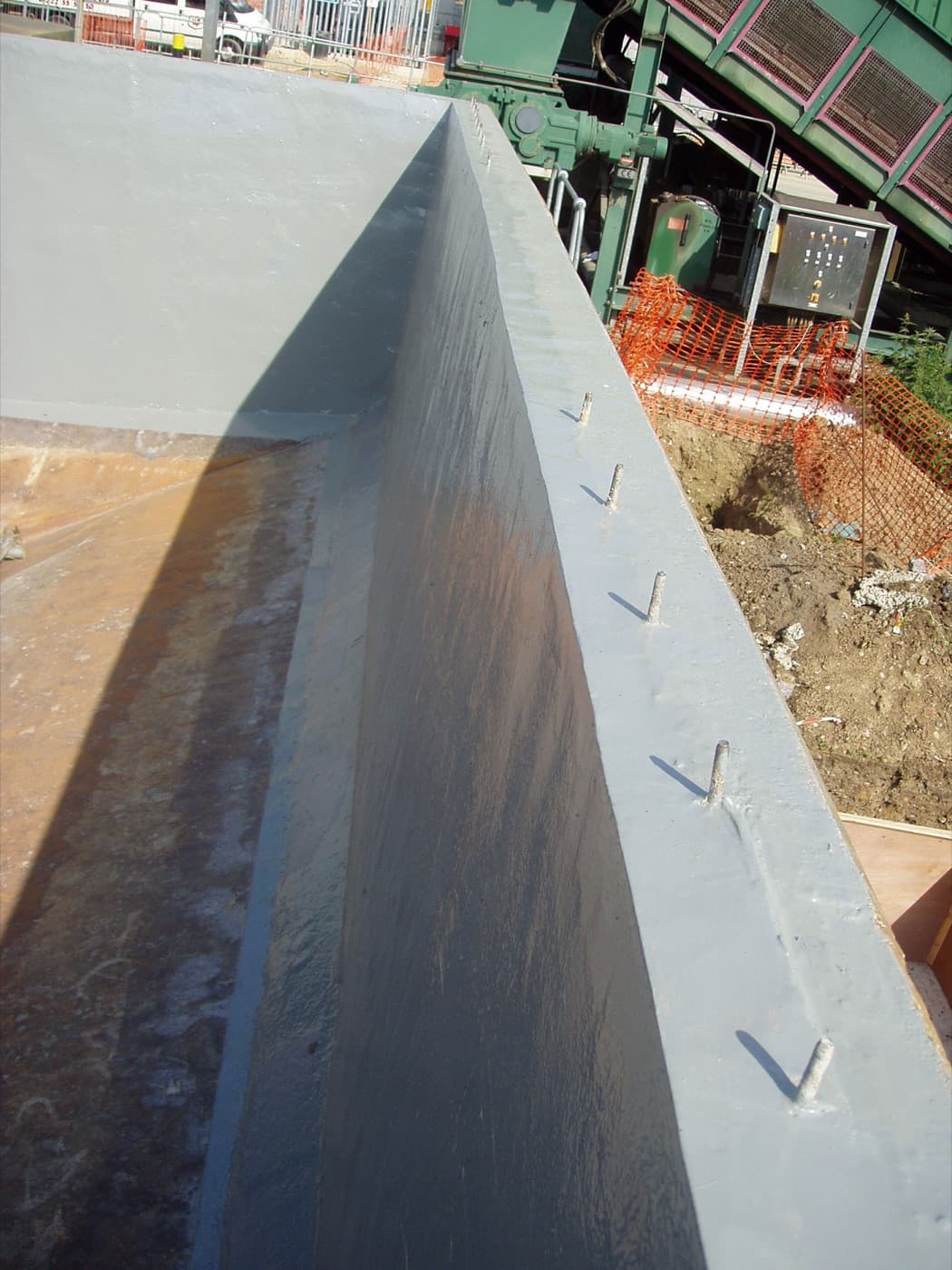 Internal wetted steel of a potable water standpipe prepared and lined by a certified Belzona applicator