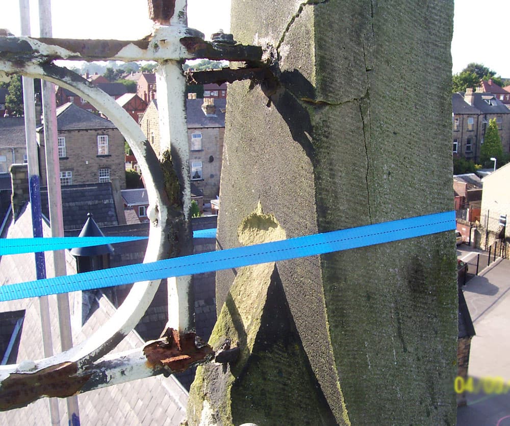 Stone tower suffering from spalling and cracking